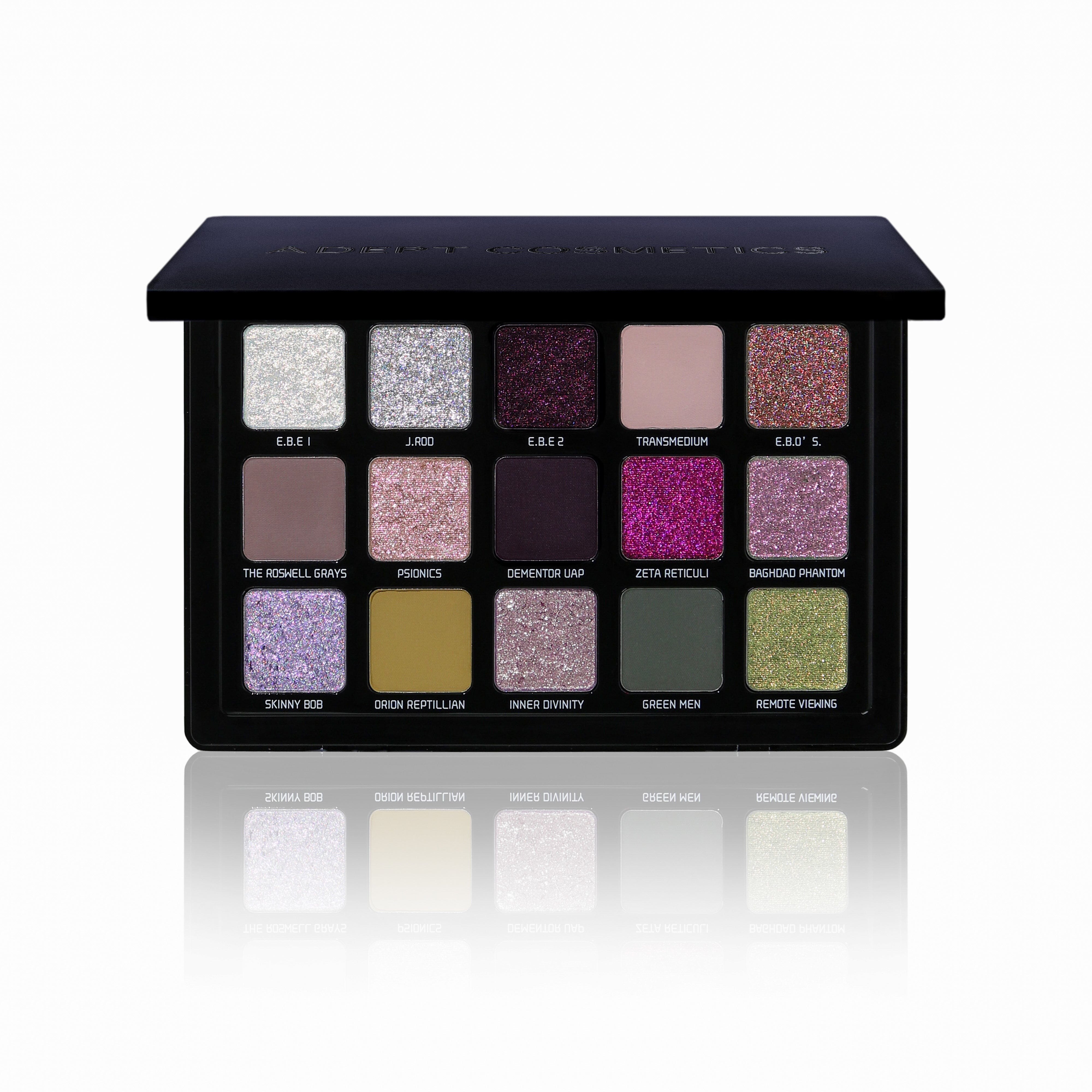 Makeup palette with various colored shades on a white background
