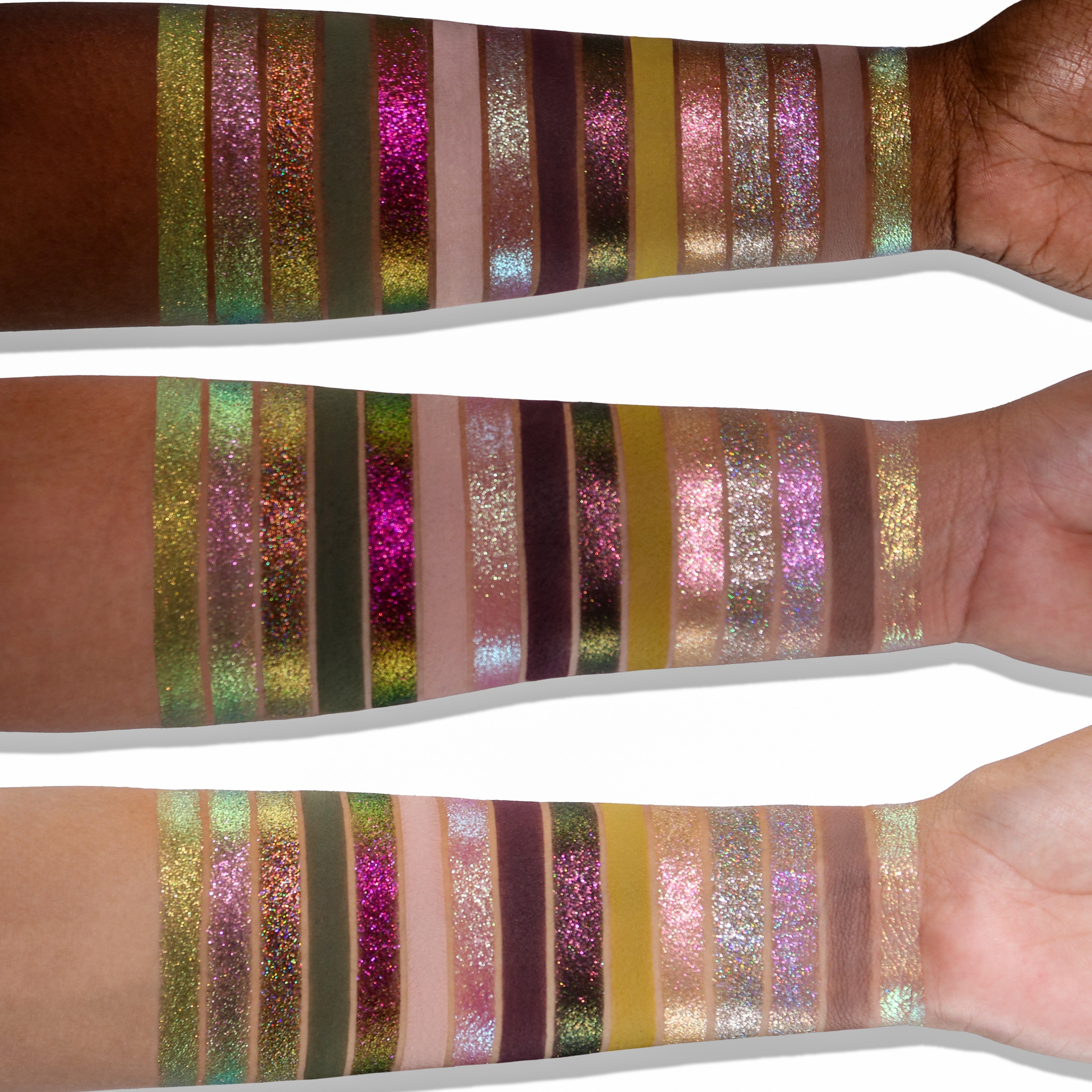 Colorful glittery eyeshadow swatches on a person's arm