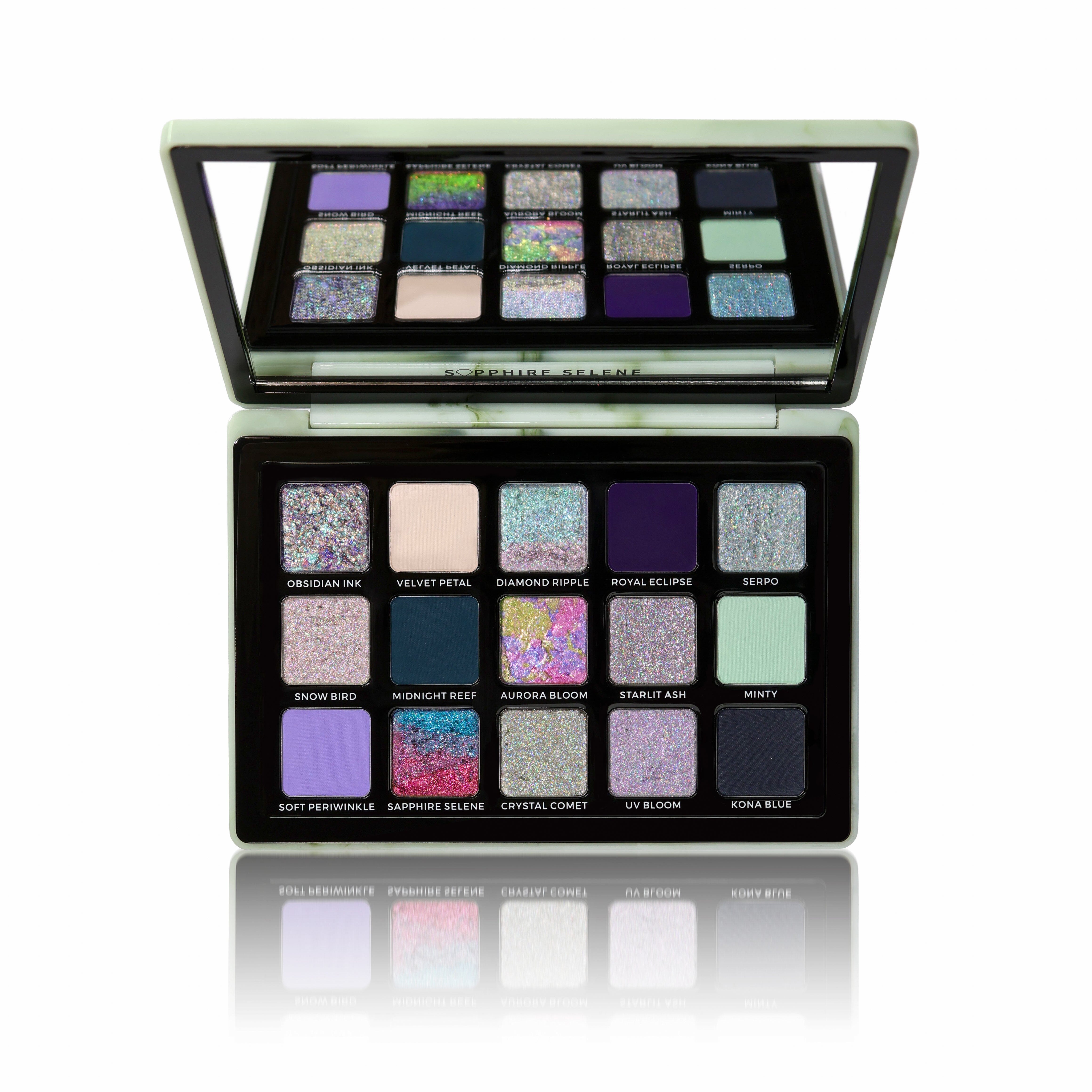 Makeup palette with various glittery shades on a white background