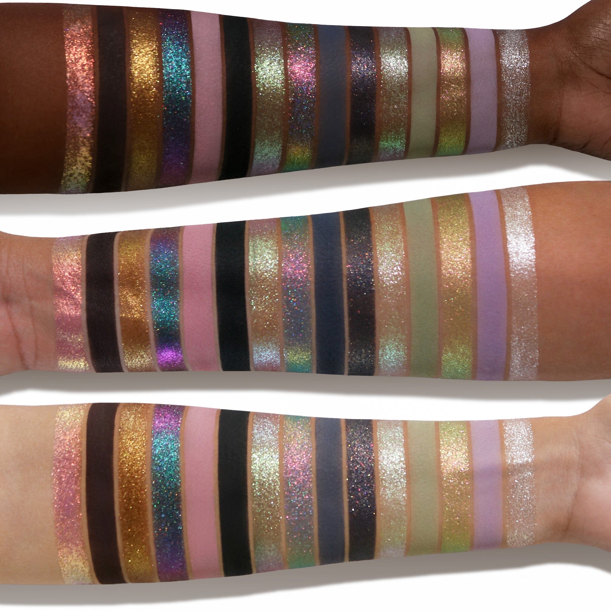 Swatches of Adept Cosmetics EMO palette on light, medium and deep skintone