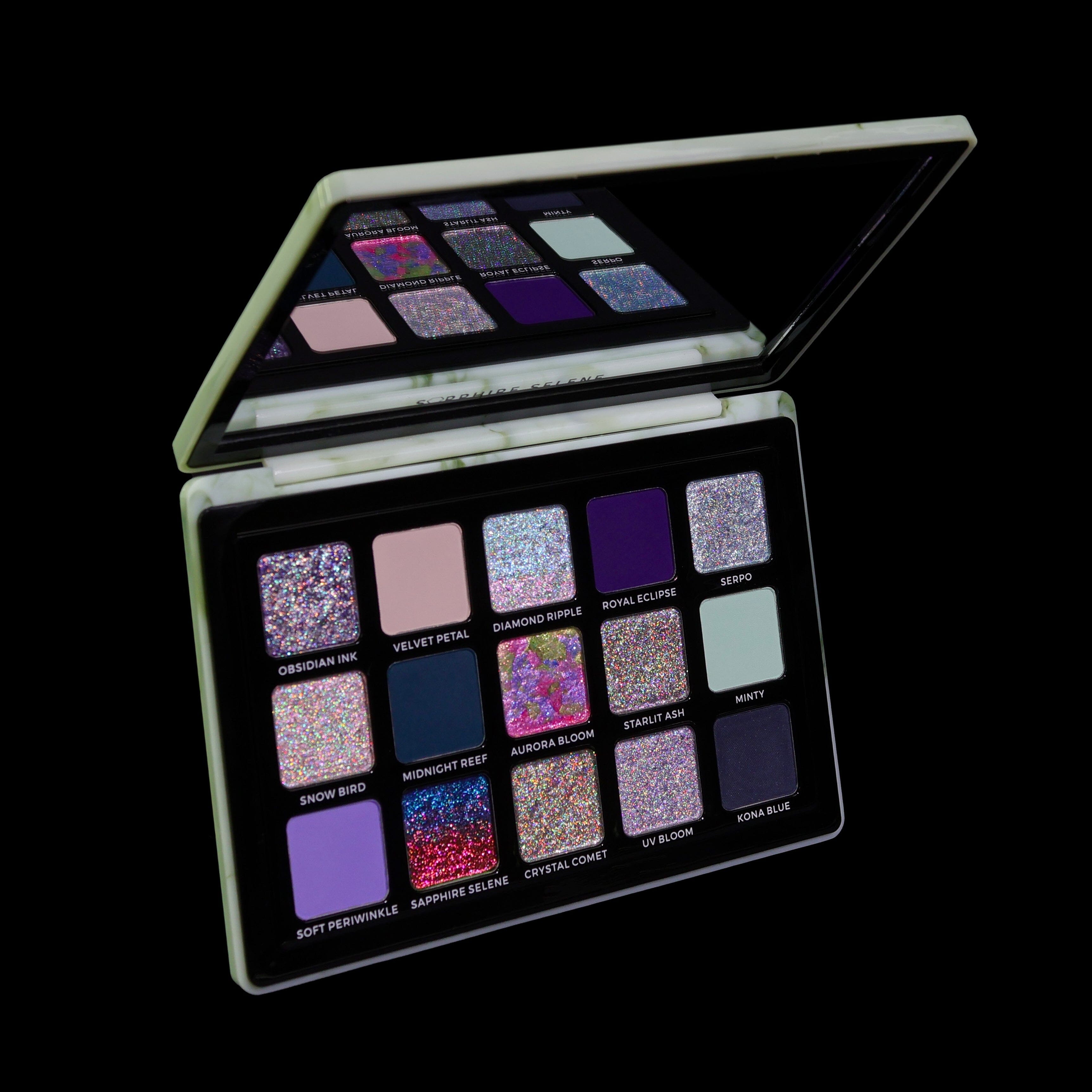 Makeup palette with various colorful shades on a black background