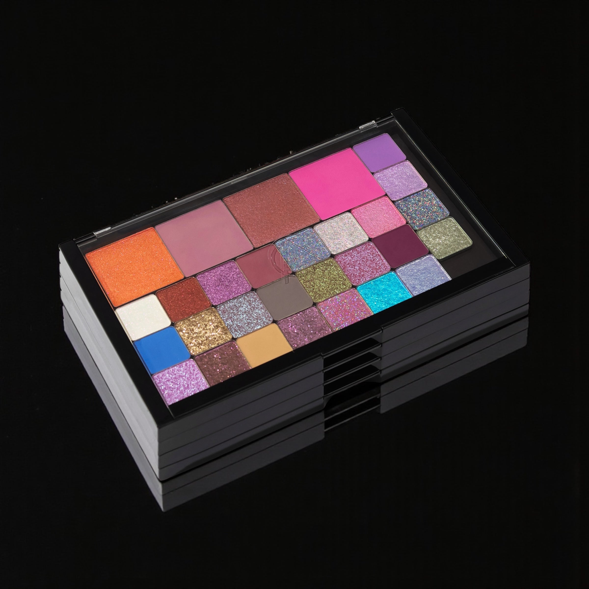Makeup palette with various colors on a black background