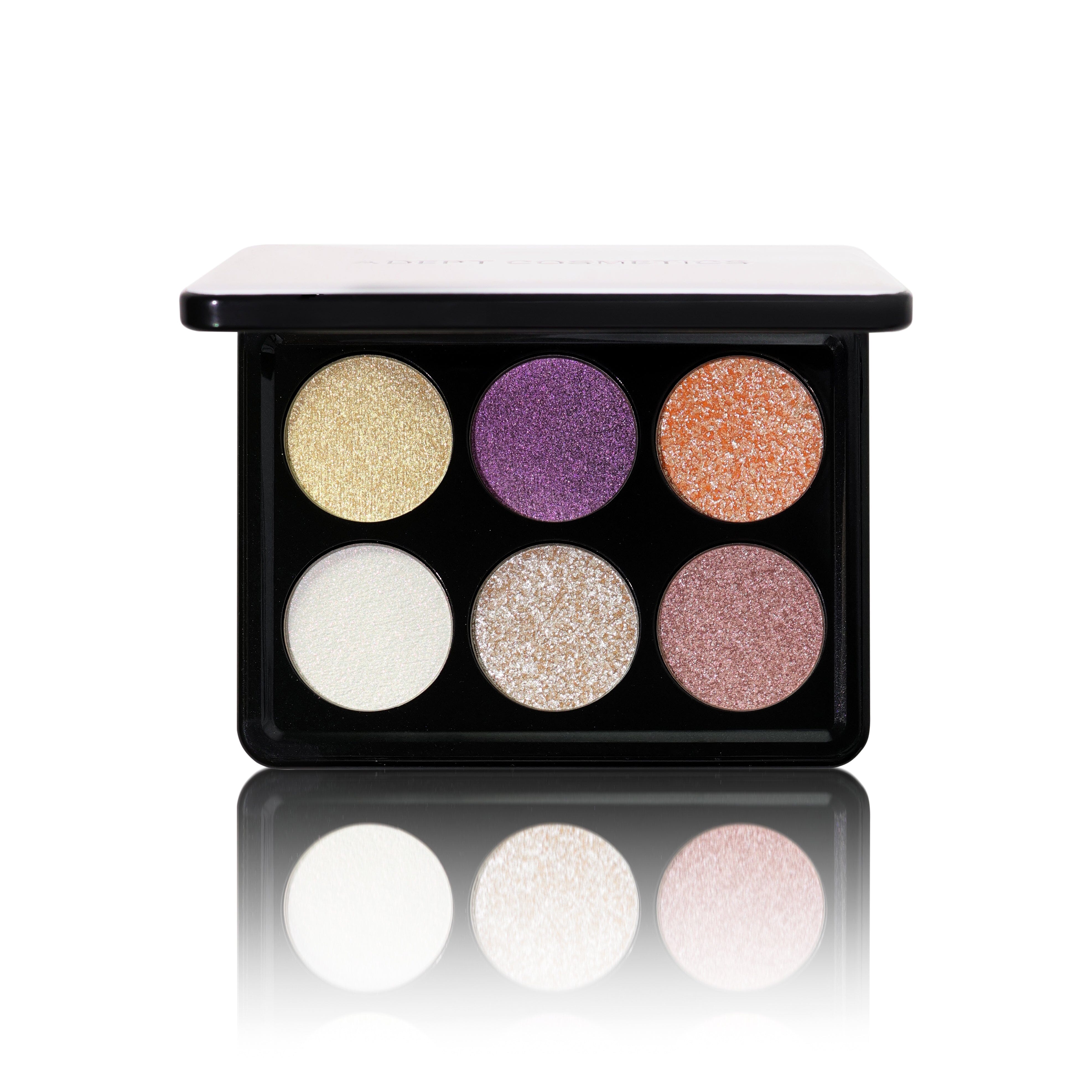 Makeup eyeshadow palette with six colorful shades on a white background
