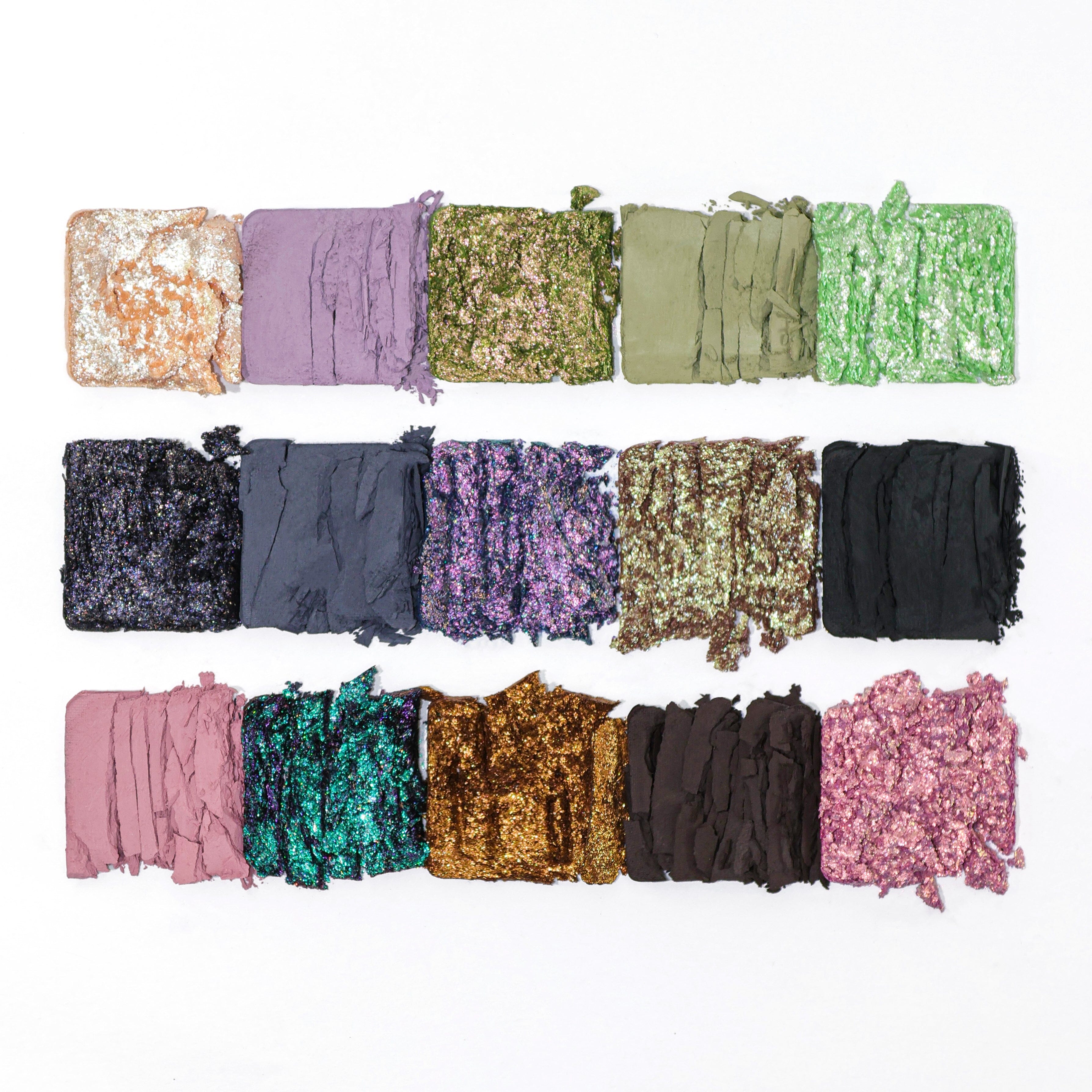 Collection of colorful sequin eyeshadow EMO Adept  samples arranged in a grid on a white background.