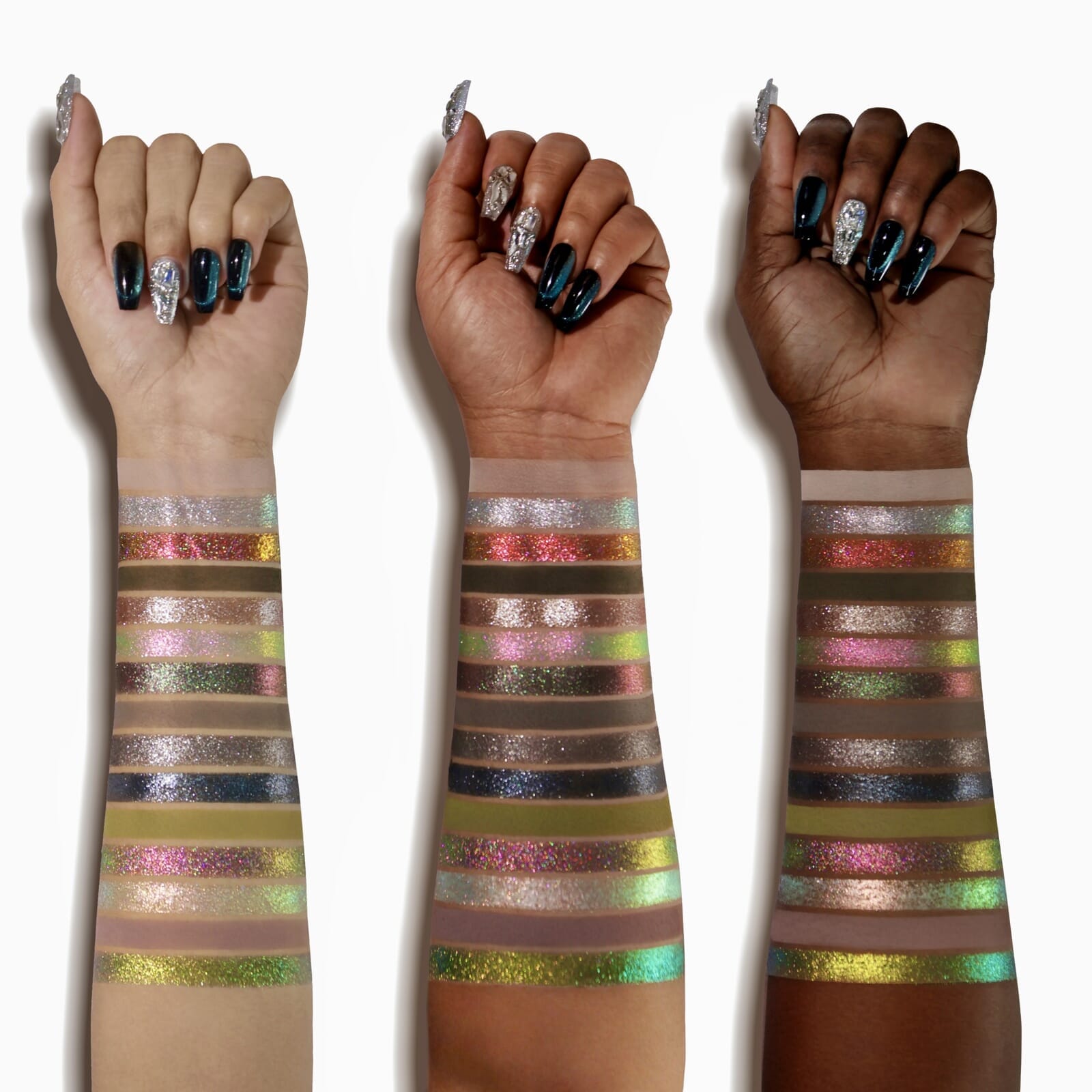 Three hands with multicolored glittery arm bands on a white background