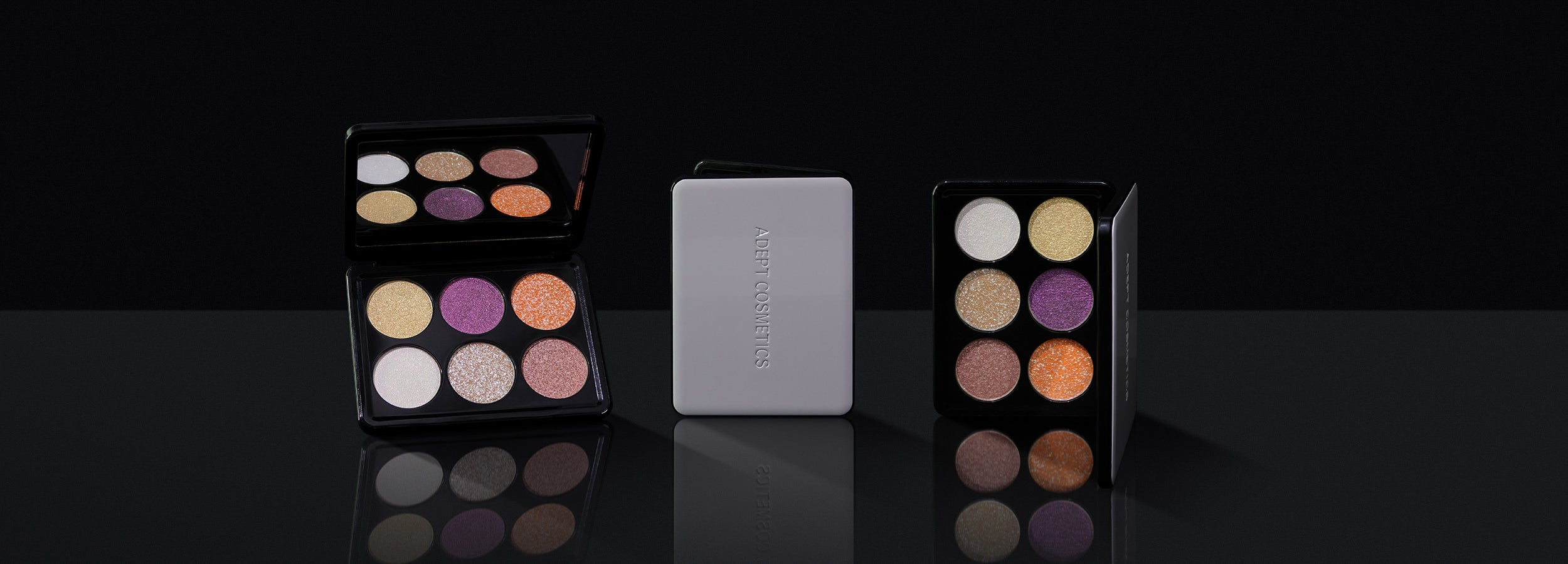 Makeup palettes with colorful shades on a black background